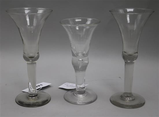 A pair of tall wine glasses, with bell bowls, on plain columns, and a wine glass with flared bowl 8in.